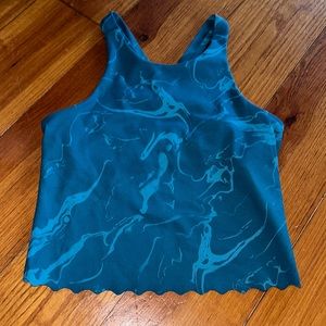 A teal marble athletic top